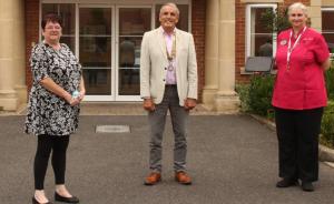 Rotary Club President Richard Everitt outside Bassett House with Care Home Manager Jackie and Activities Coordinator Jackie 